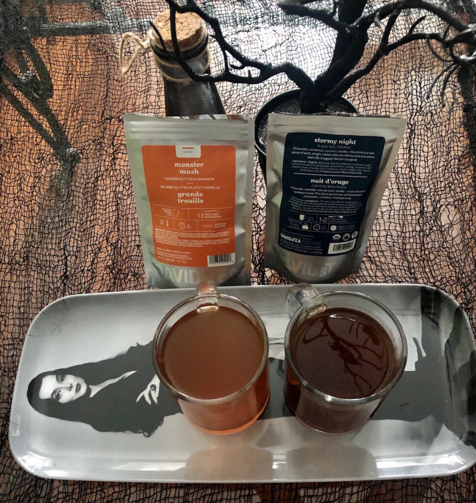 Packets of David's tea Monster Mash and stormy night with the teas in cups on a Morticia Adams tray